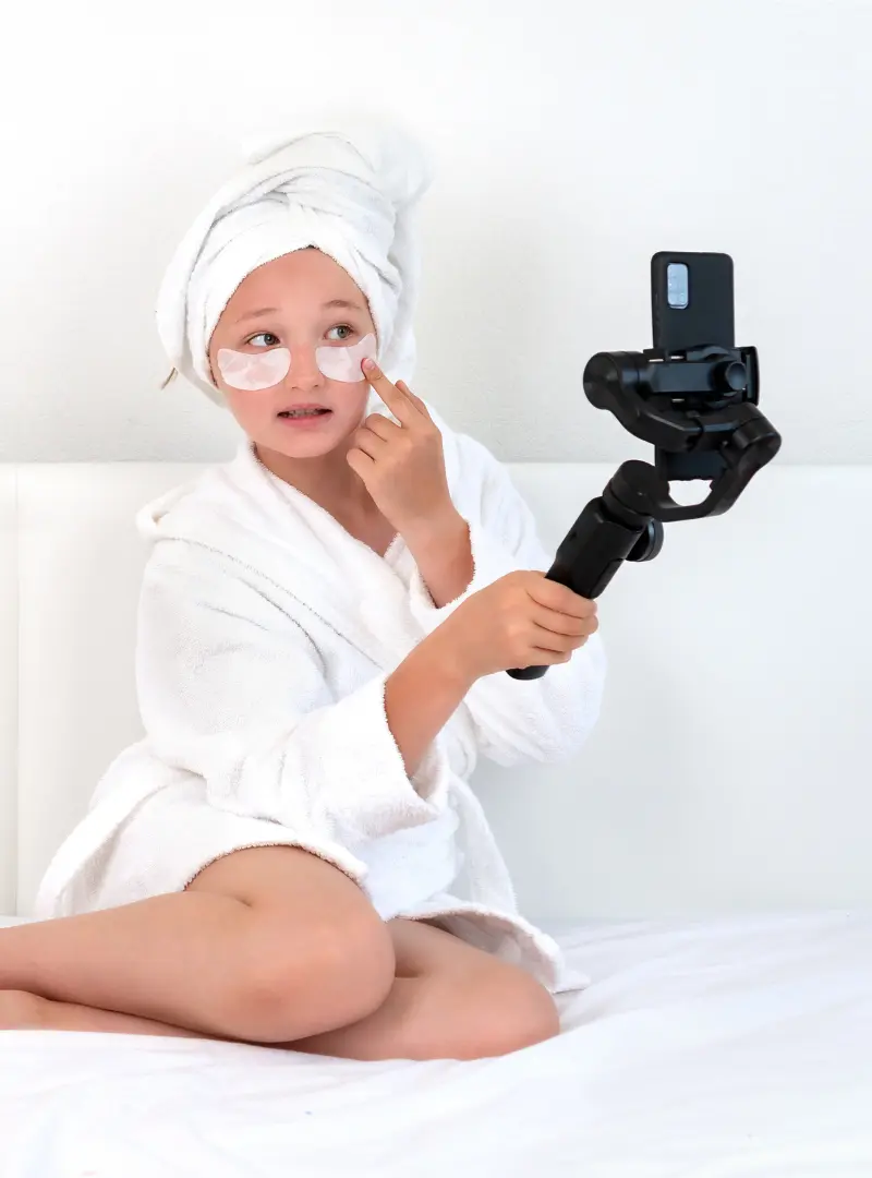 child after bath recording a video